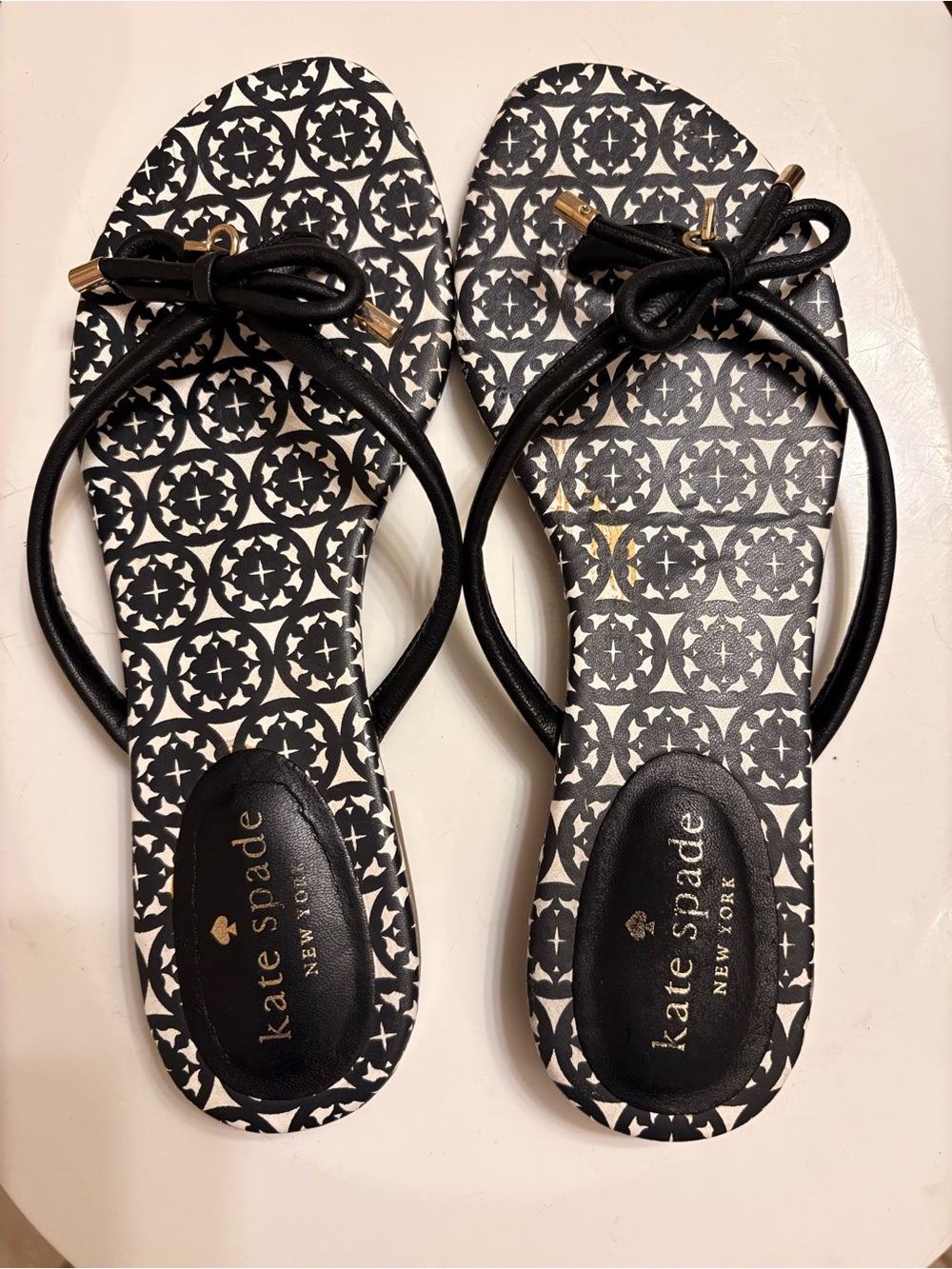 kate spade Black & White Patterned Bow Sandals with Gold Accents